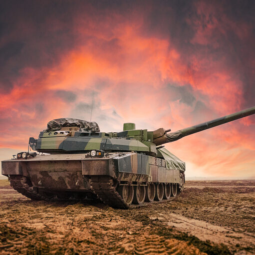 Main battle tank in the vast open field. Dramatic sky background